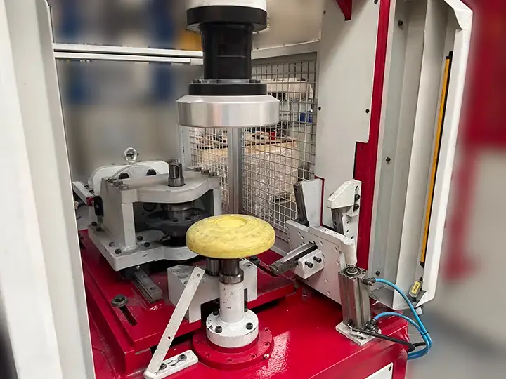Trimming machine blade adjustment system for stainless steel dish heads