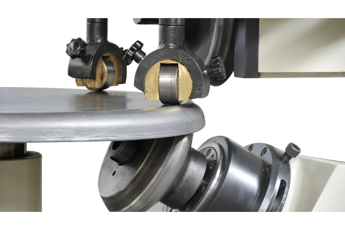 Flanging rolls forming the edge of a dished part on a DHKM.