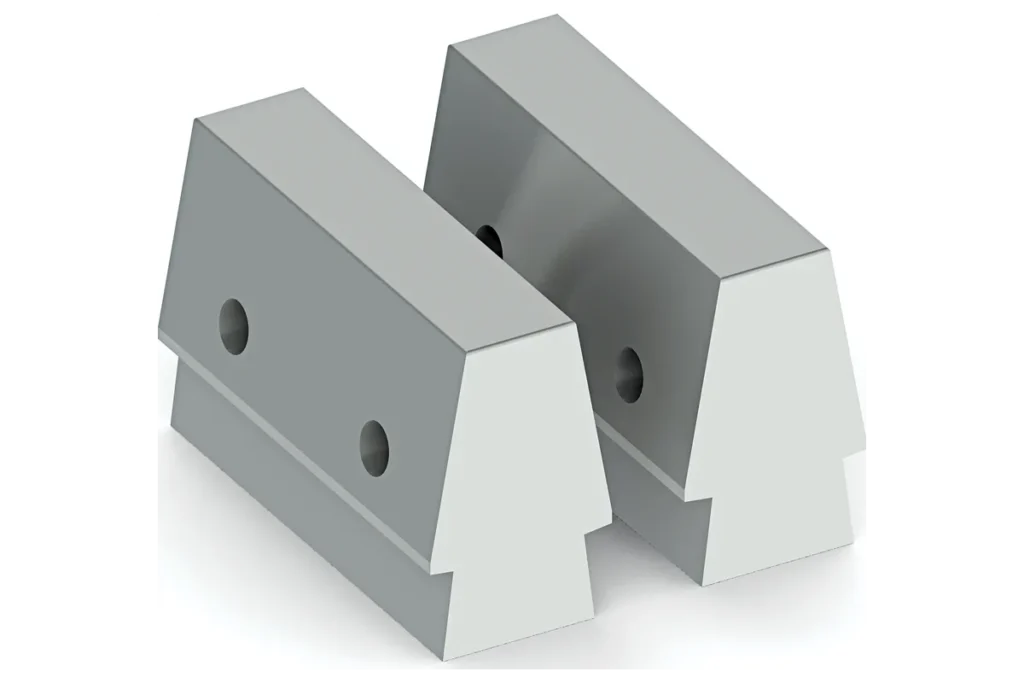 Upper and lower FHM forging dies with angled faces.