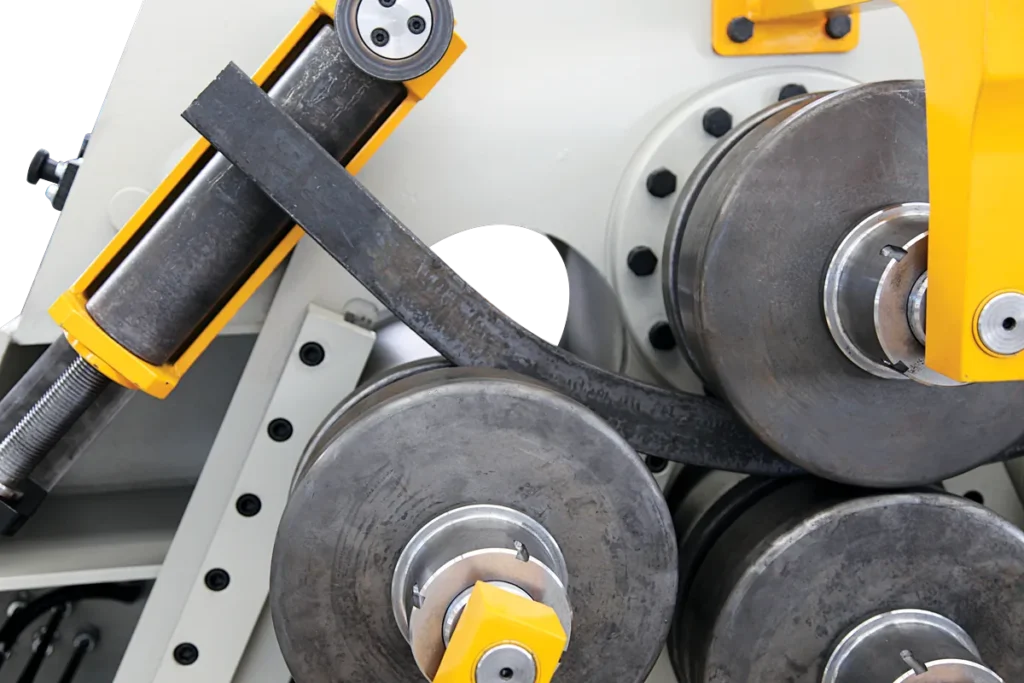 Flat bar being rolled between the four rolls of a PBH 4V.