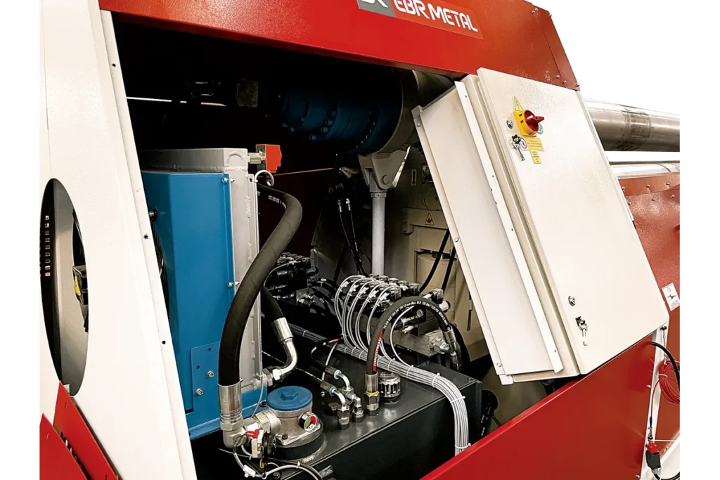 Hydraulic unit inside a 4V HMK 4-roll plate bending machine.