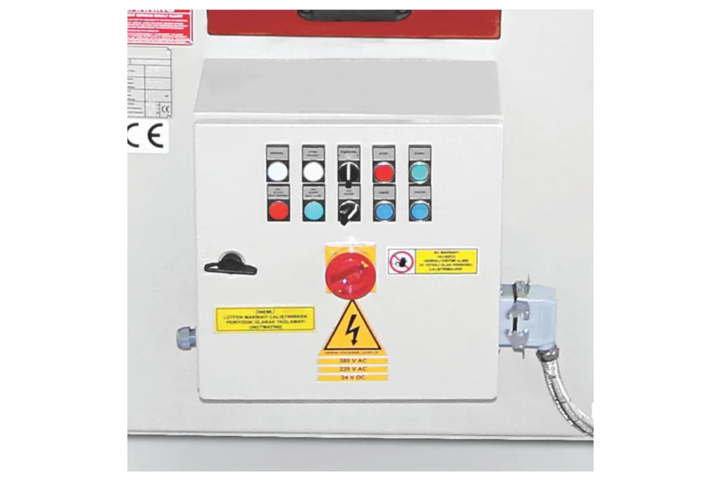 Control panel of an HCN hydraulic corner notching machine with emergency stop.