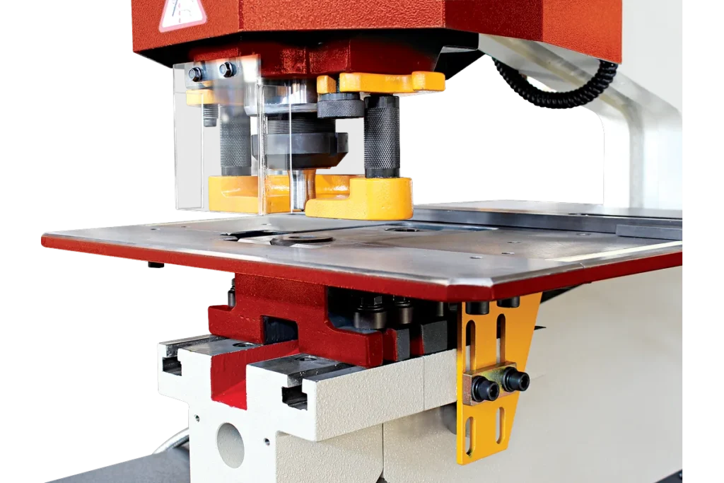 Punching station of an HDM with punch holder, guard and work table.