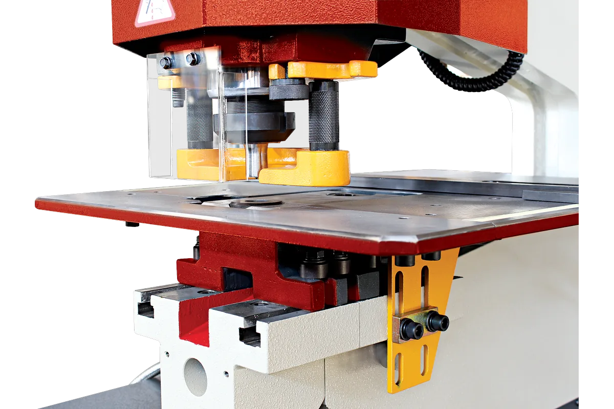 Punching station of an HDM with punch holder, guard and work table.