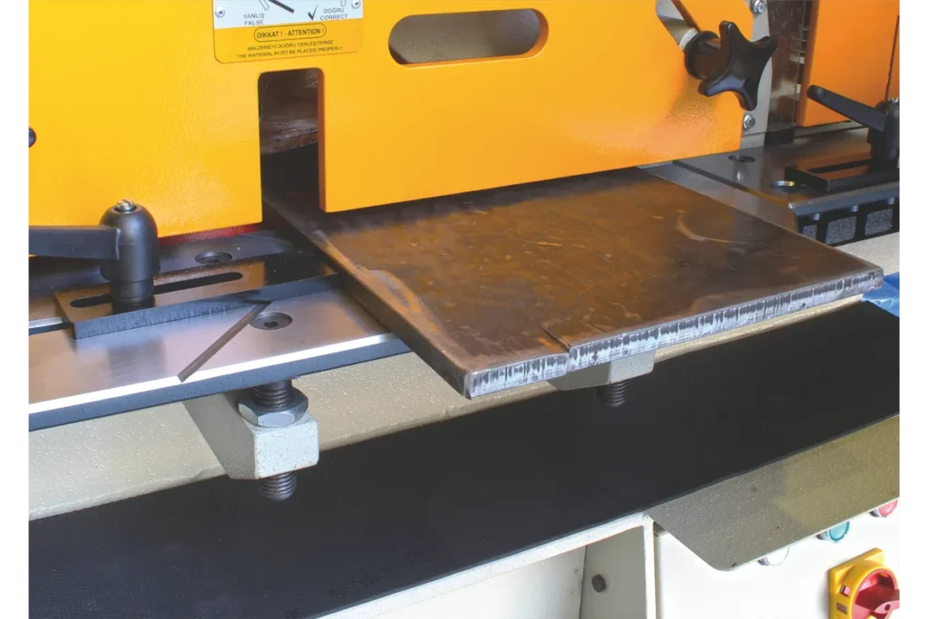 Plate and flat bar shearing station of the HSW with a plate on the table.