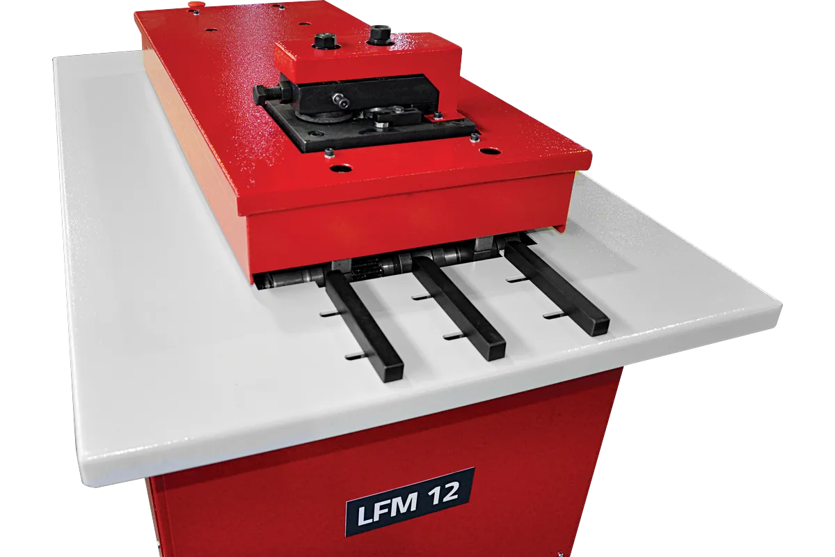 Sheet guides and roll stations on top of the LFM 12 lock former.
